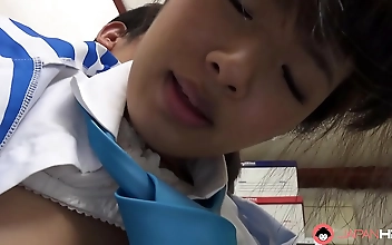 Dark Haired Asian Woman Gently Touches Herself For